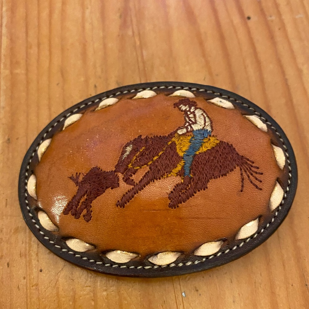 Tony Lama hand stitched leather rodeo calf roper belt buckle.